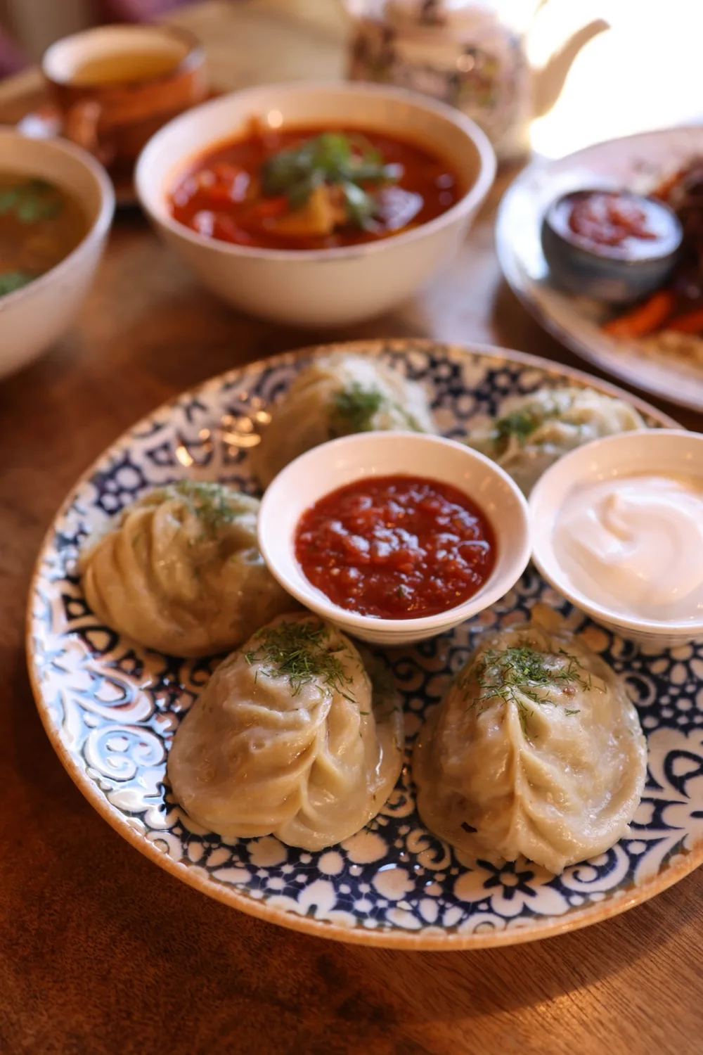 Georgian dumplings served with herbs and sauces